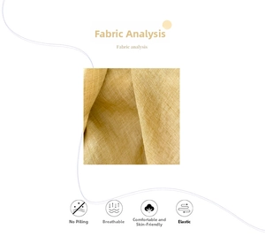 Close-up of yellow cotton linen scarf fabric showing breathable texture and soft weave