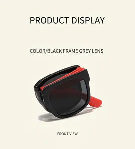 Detail of portable folding kids sunglasses with black square frames and grey lenses