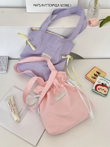 Minimalist canvas drawstring tote bag in soft purple and pink for daily office commuting