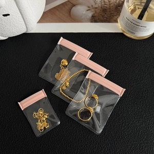 Transparent EVA jewelry storage bags with pink zip seal for earrings and necklaces