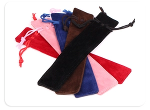 Assorted colorful velvet drawstring pouches for pens and jewelry organized in a fan shape