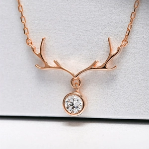 Elegant rose gold reindeer antler necklace with a round brilliant-cut zircon pendant