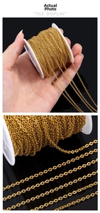 Macro detail of 18k gold plated stainless steel sunflower chain on a white spool