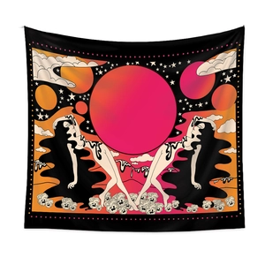 Close-up of Bohemian tapestry showing detailed fabric texture and sun moon illustration