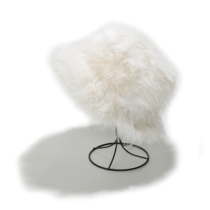 Detailed view of fluffy white faux fur bucket hat with silver metallic threads on stand