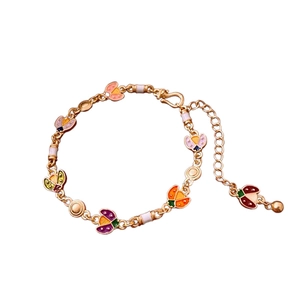 Colorful enamel ladybug bracelet with a gold-plated adjustable chain for women
