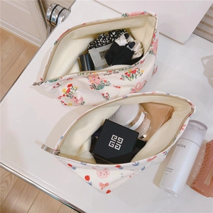 Detail of cute rabbit pattern cotton makeup bags showing spacious interior and golden zipper