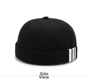Side view of black brimless cotton beanie featuring three white decorative side stripes