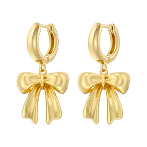 Elegant gold bow-shaped hoop earrings with a polished finish on a white background
