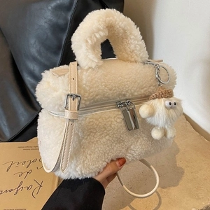 Chic cream faux shearling crossbody bag with cute plush pendant and leather strap