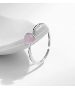 Macro shot of S925 sterling silver ring with pink heart cat's eye stone detail