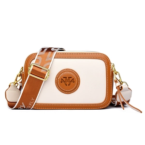 Retro cream and brown crossbody bag with wide fabric strap and golden hardware accents