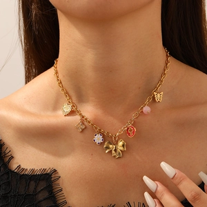 Gold butterfly flower and cross multi-pendant chain necklace for a trendy vintage look