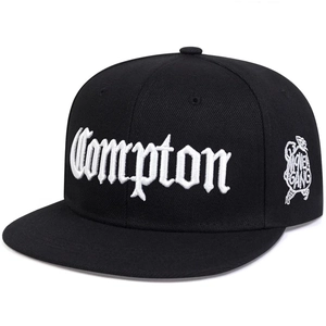Black Compton snapback hat with white 3D embroidery shown from a 45-degree angle