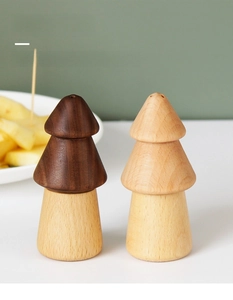 Minimalist pine-shaped toothpick holders in dark walnut and light natural wood finishes