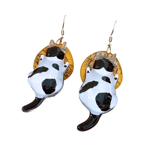 Handmade resin cat drop earrings with black and white spotted kitten and amber rings