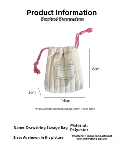 Close-up of cream quilted polyester drawstring storage bag showing 14x8x3cm dimensions