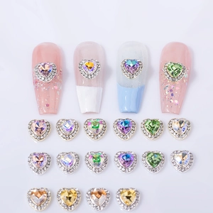 Sparkling heart nail art crystals with rhinestone borders in assorted vibrant colors