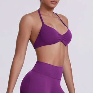 Detail view of purple seamless halter sports bra and high waist leggings for yoga workout