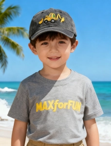 Detail of children's washed baseball cap with yellow excavator embroidery on grey fabric