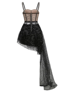 Detail of sheer mesh party dress featuring black sequins and rhinestone shoulder straps