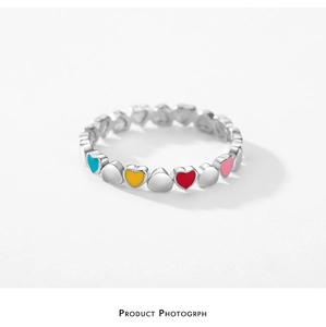 Detailed view of S925 sterling silver heart ring with multi-colored enamel finish