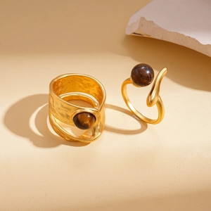 Vintage gold layered rings with natural brown tiger eye stones and hammered texture