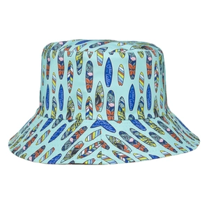 Reversible bucket hat with surfboard print and ocean calling text for beach sun protection
