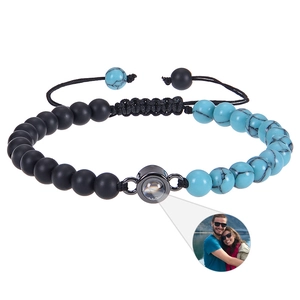 Detail of adjustable beaded projection bracelet with black beads and turquoise accents
