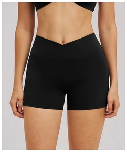 Detailed front view of high-waisted yoga shorts with V-crossover waistband in black fabric