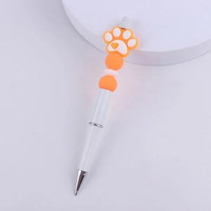 Detail of DIY beaded pen featuring a cute orange silicone cat paw and colorful round beads