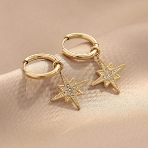 Luxurious gold eight-pointed star hoop earrings with sparkling crystal center