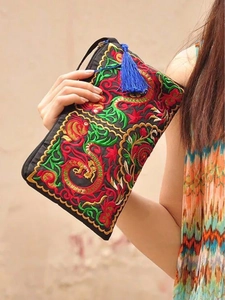 Ethnic embroidered satin clutch bag with dragon pattern and decorative blue tassel