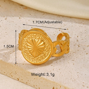 Macro view of a gold heart embossed ring with chain-style adjustable band detail
