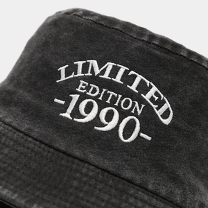 Vintage washed cotton bucket hat featuring white Limited Edition 1990 embroidery detail