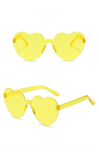 Detail view showing front and side angles of fluorescent yellow heart-shaped rimless sunglasses