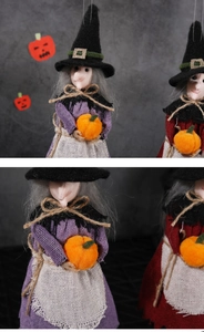 Detail of hanging Halloween witch dolls in purple and red holding a pumpkin