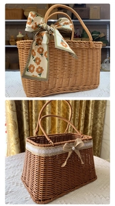Detail of woven picnic basket featuring floral silk scarf and elegant lace bow decoration