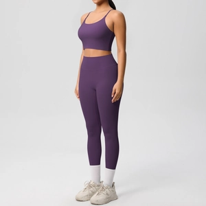Deep purple yoga set featuring a thin strap sports bra and high-waisted leggings