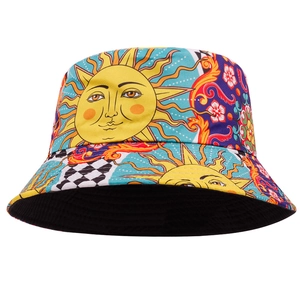 Detail shot of the vibrant sun face pattern and fabric texture on a street graffiti bucket hat