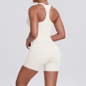 Back view of off-white racerback sports bra and high-waist yoga shorts for women