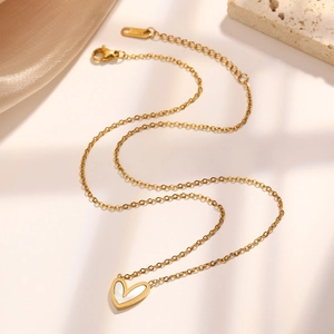 Elegant gold heart necklace with white mother-of-pearl inlay and adjustable chain links
