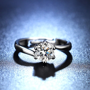 Detail showing classic six-prong moissanite setting and elegant twisted adjustable band