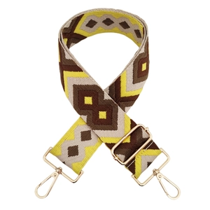 Close-up of geometric diamond jacquard wide shoulder strap with light gold metal lobster clasps