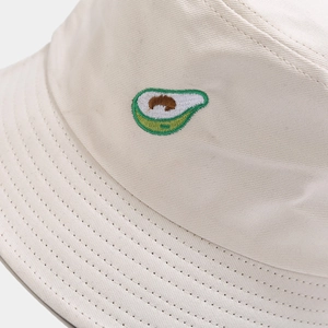 Beige cotton bucket hat with detailed avocado embroidery and premium stitching finish