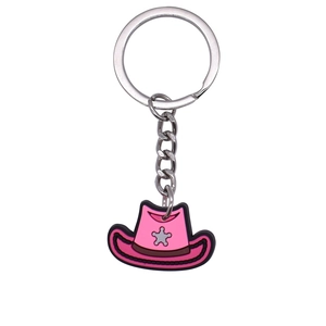 Pink PVC cowboy hat keychain with grey star pattern and metallic keyring on white background
