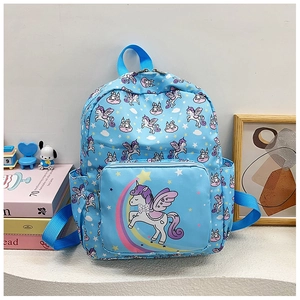 Detail of blue school bag with cartoon unicorn and rainbow prints in a cozy room setting
