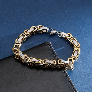 Detail of silver and gold bicolor Byzantine chain bracelet with large lobster clasp