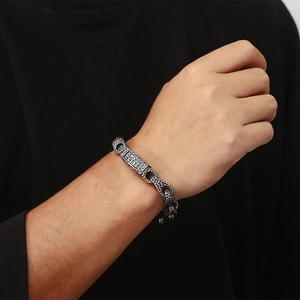 Close-up of industrial hammered texture on vintage titanium steel bracelet for men