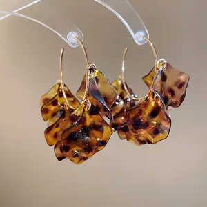Vintage leopard print petal hoop earrings in gold metal and amber resin for women